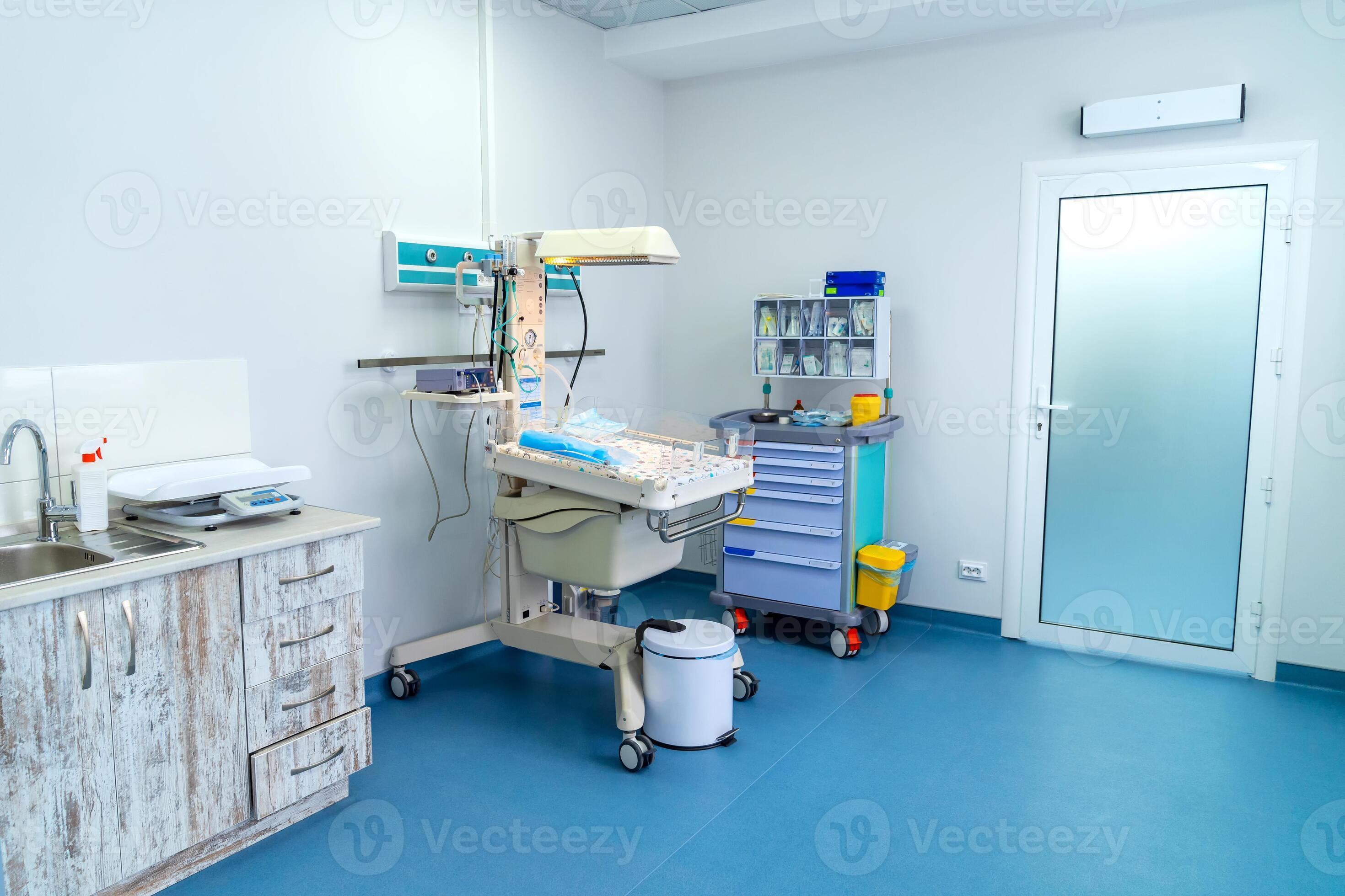 Hospital baby emergency ward. Modern clinical baby bed in surgery room