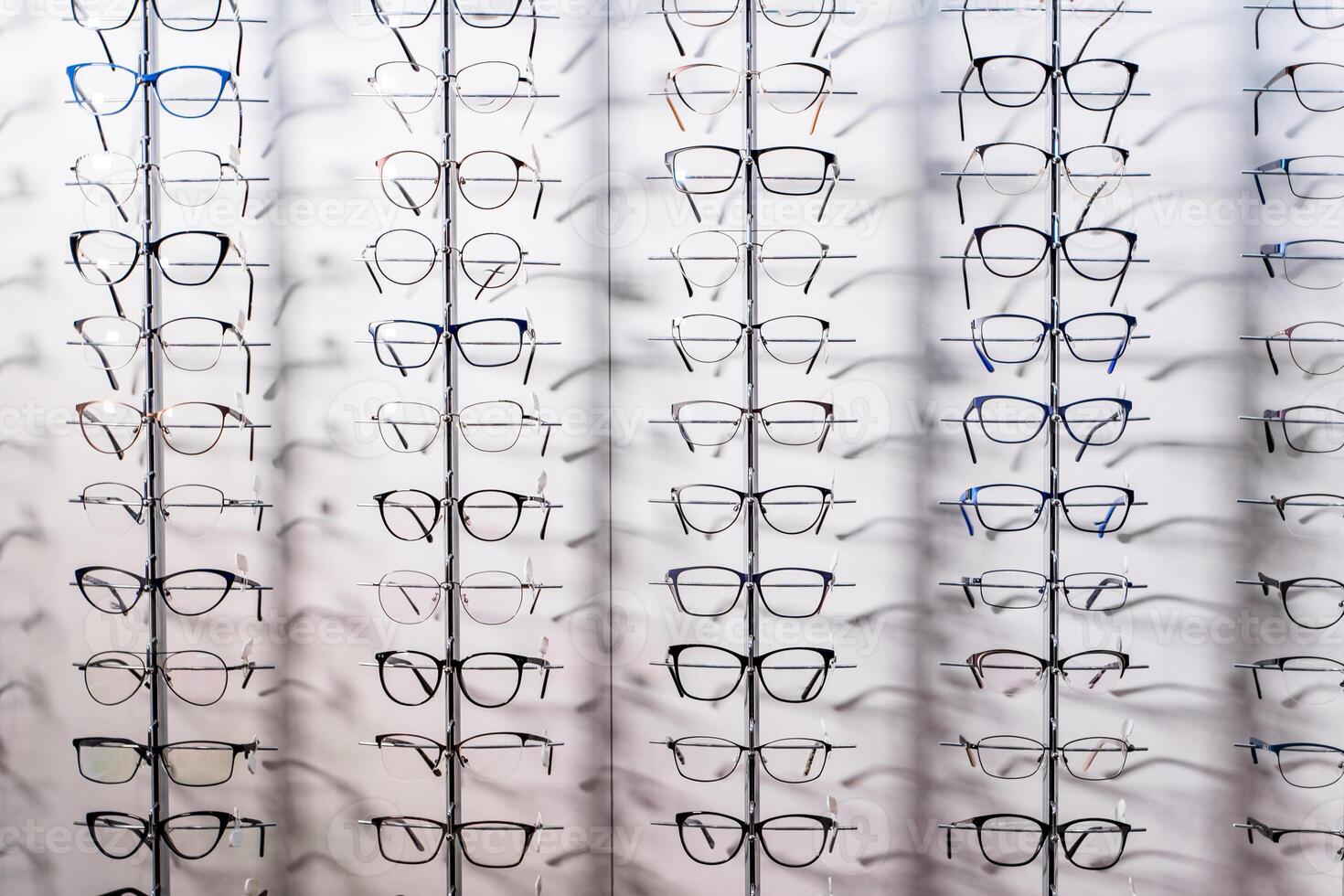 Row of luxury eyeglass at an opticians store. Gglasses background photo