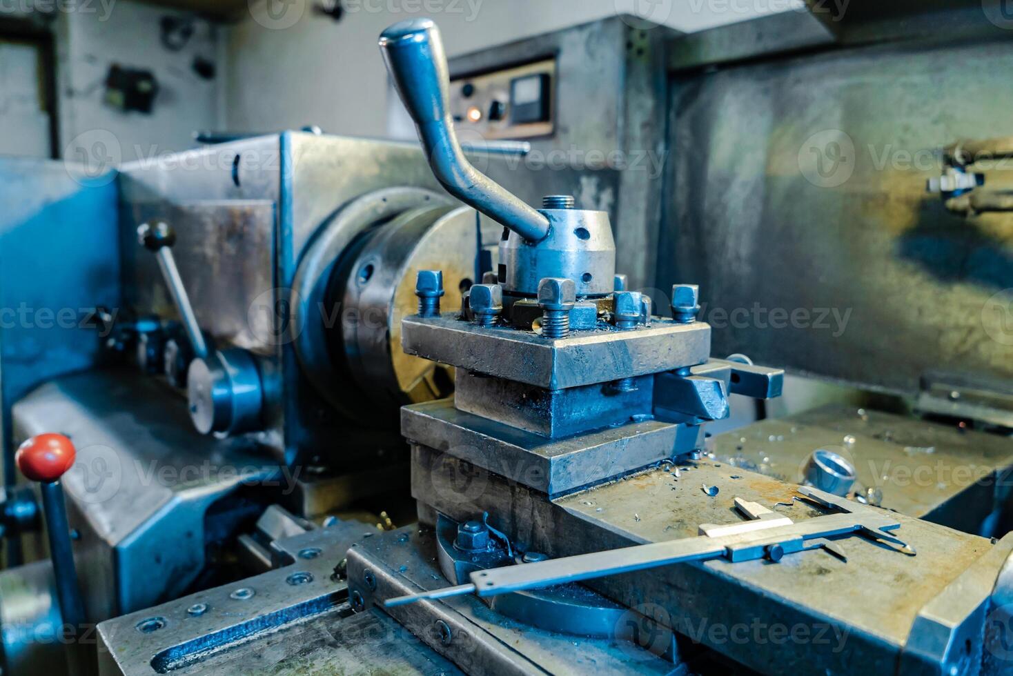 view of the professional metal lathe at the factory. Close-up photo