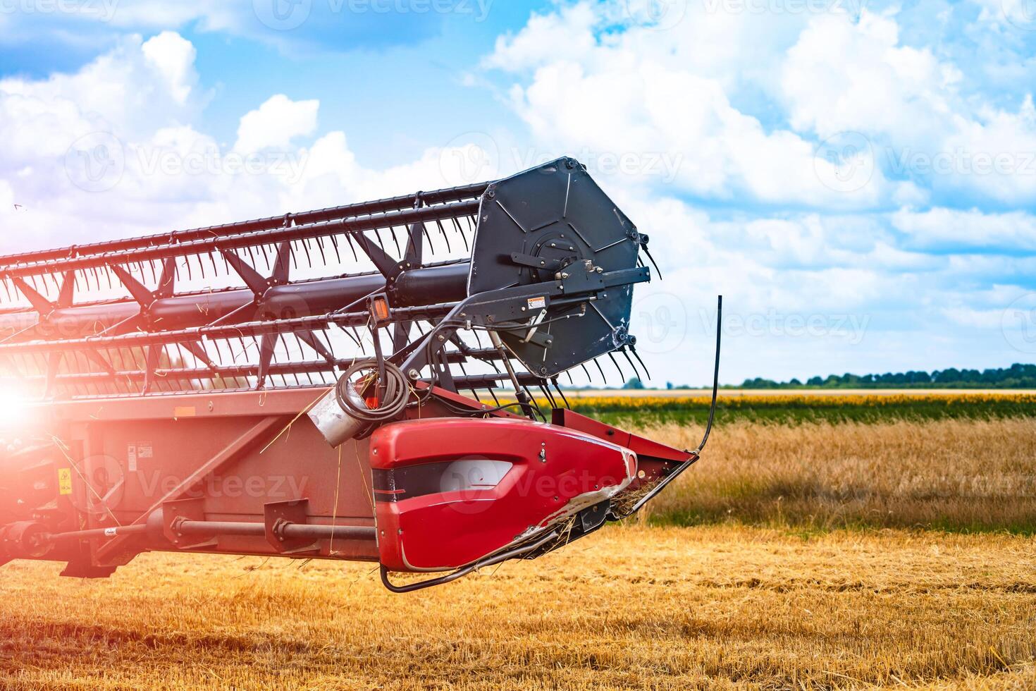 Closeup of harvesting machinery detail while working the field photo