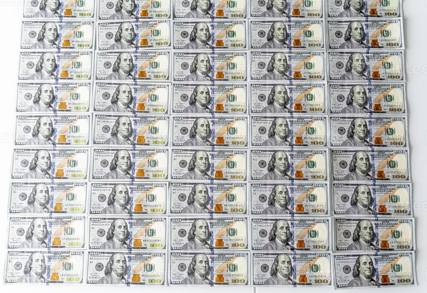 A Pile of Twenty Dollar Bills on a Clean White Surface photo