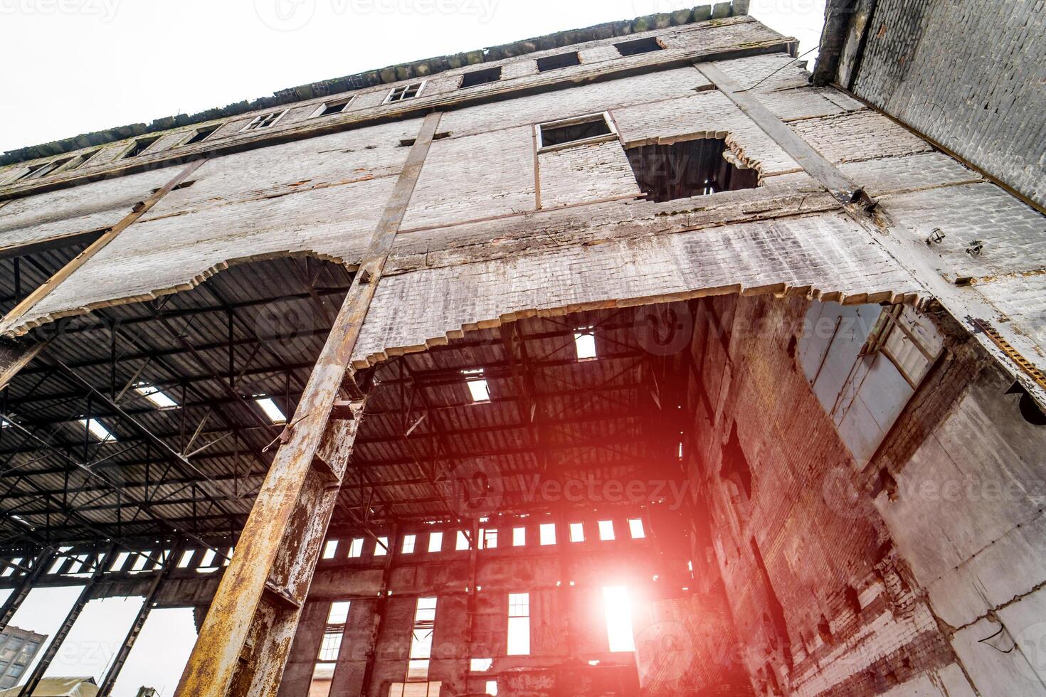 Abandoned ruined industrial factory building, ruins and demolition concept photo