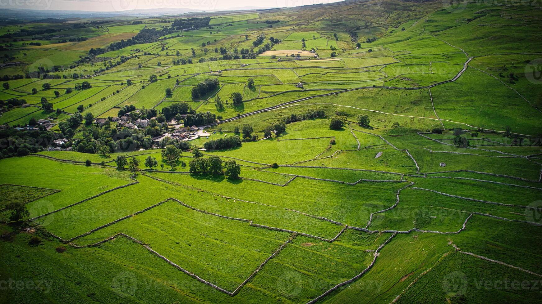 Aerial view of the small village and farm land in Yorkshire photo