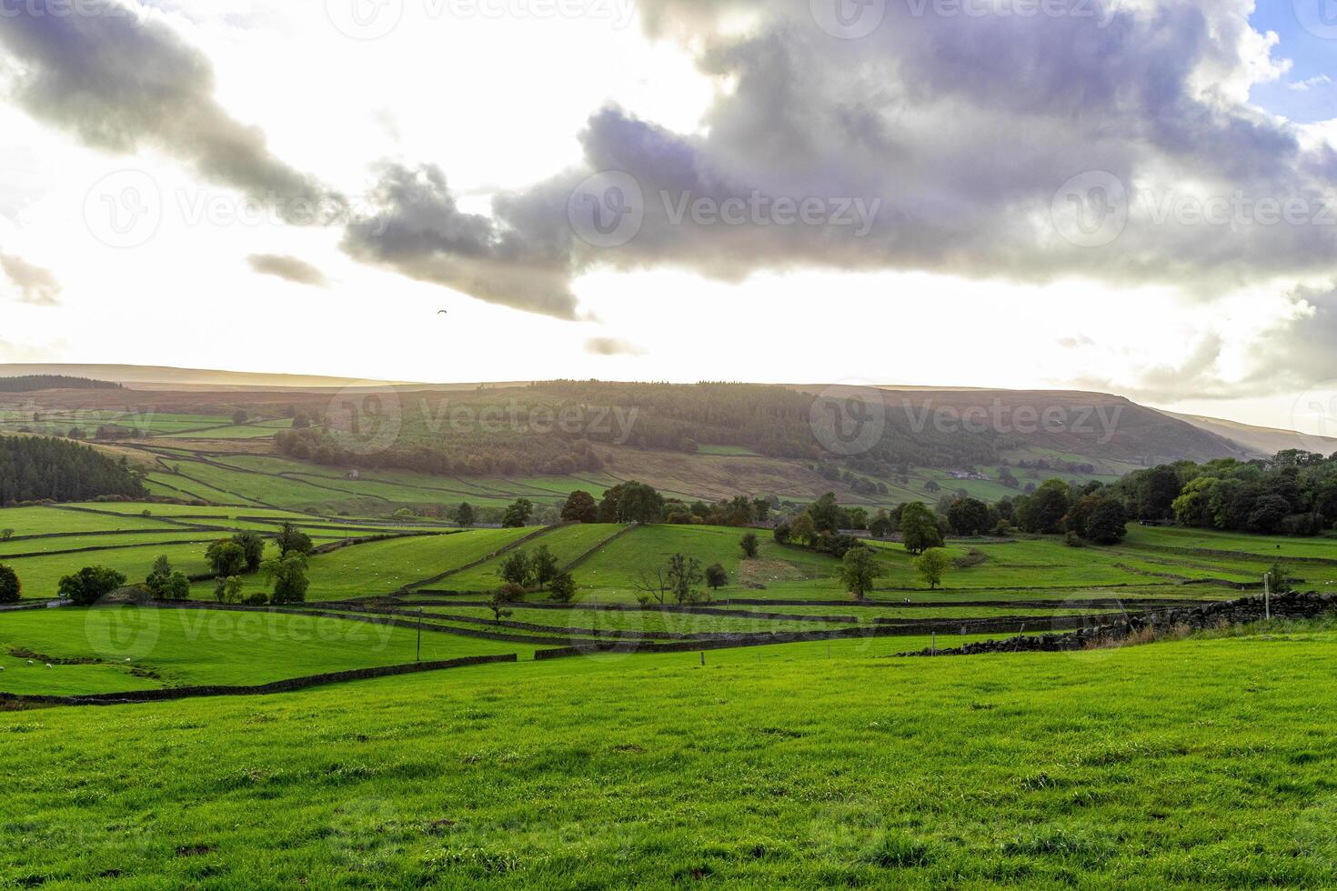 Scenic landscape photo in Yorkshire Dales with clouds and sunset
