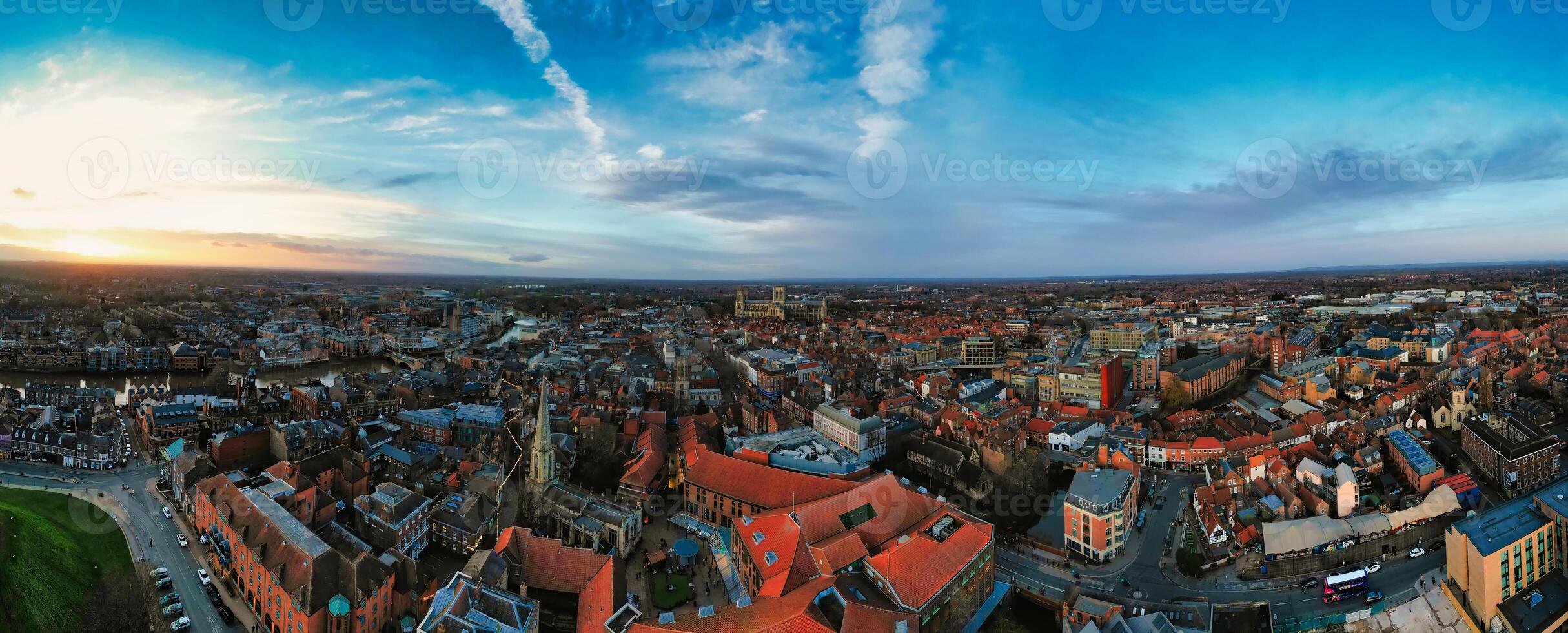 Panoramic aerial view of a cityscape at dusk with historic buildings and a dramatic sky in York, North Yorkshire photo