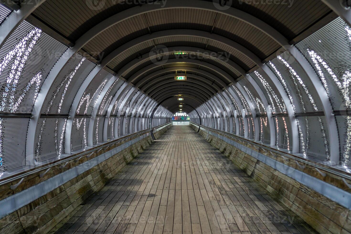 Footpaht and walkway trough a tunnel over the road and railway from the Hilversum Media Park to the nearby train station. photo