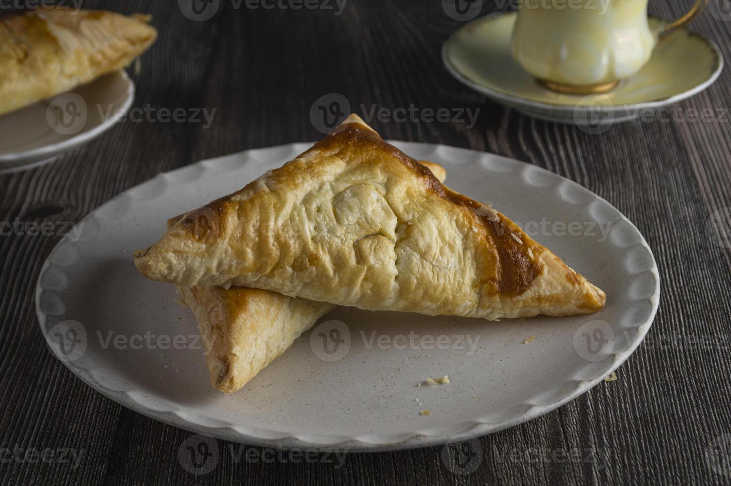 a plate with two triangles of pie on it photo