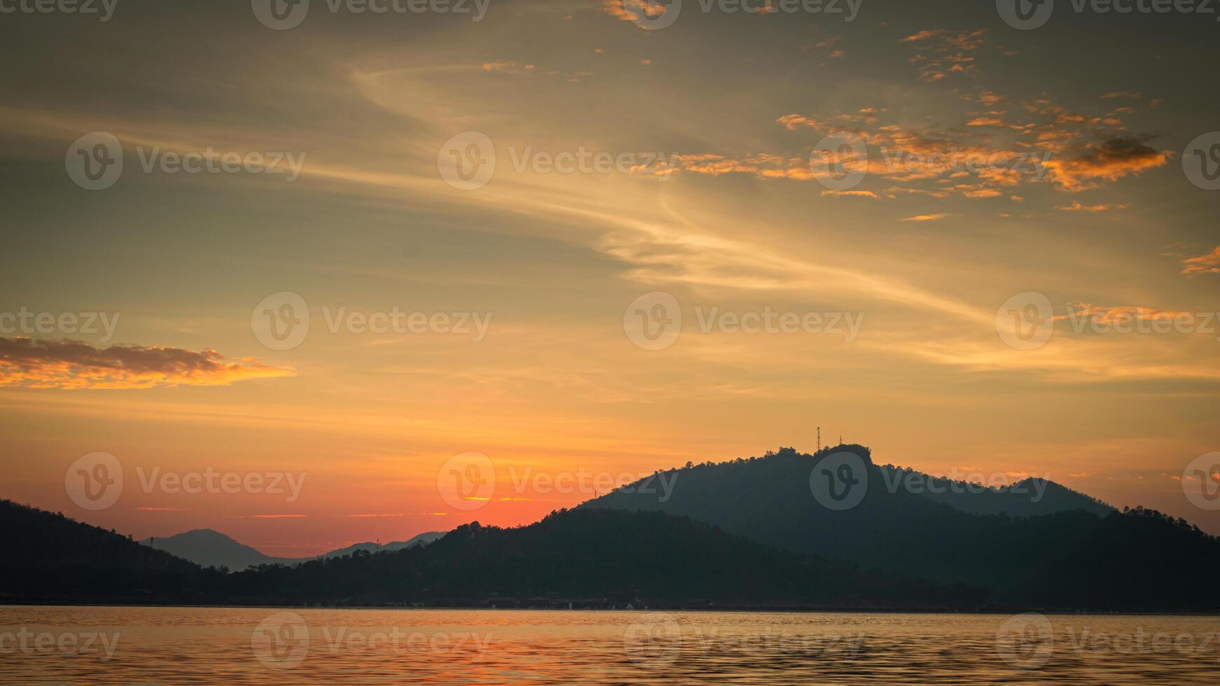 a sunset over the mountains photo