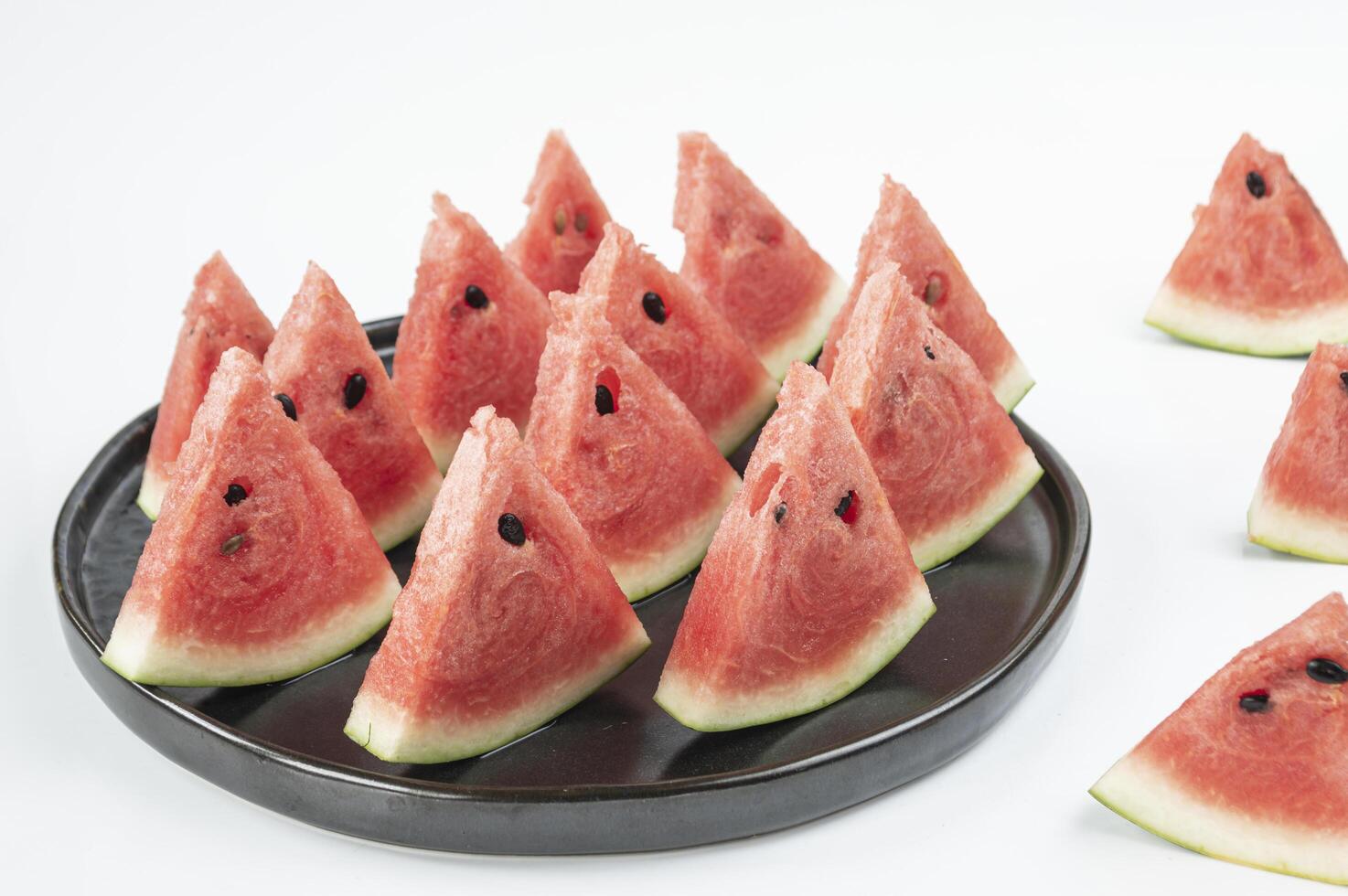 watermelon slices on a plate with white background photo