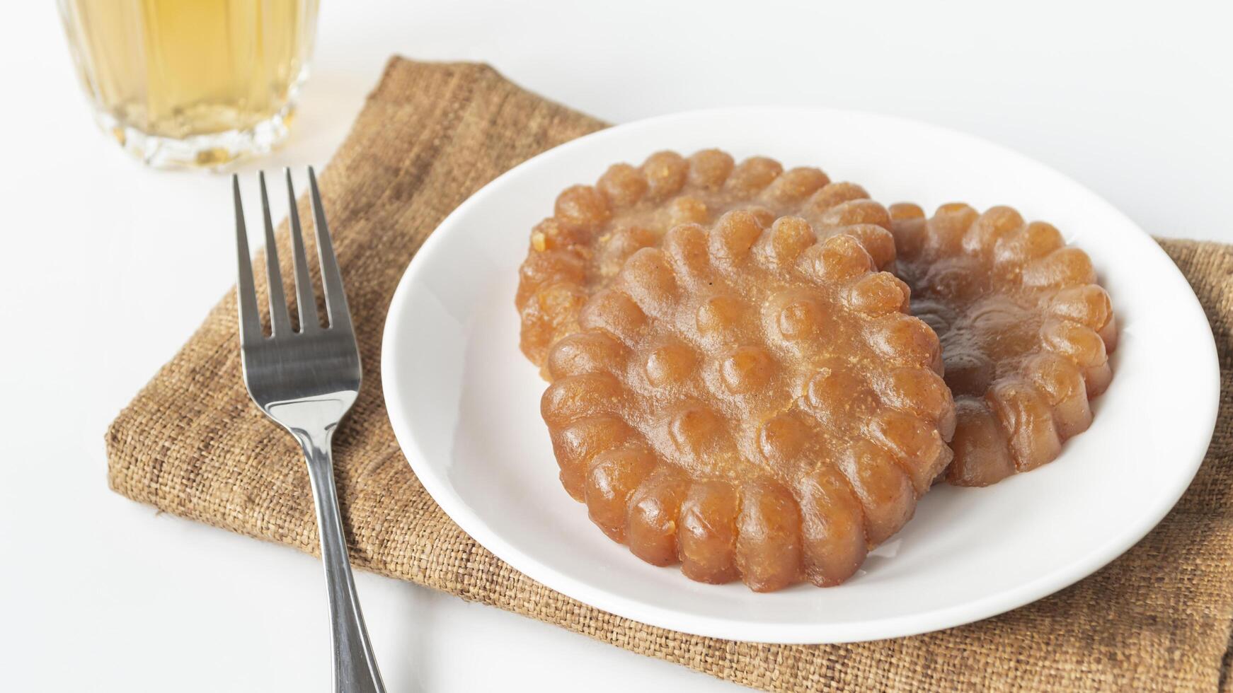 a plate with some brown pastries on it photo