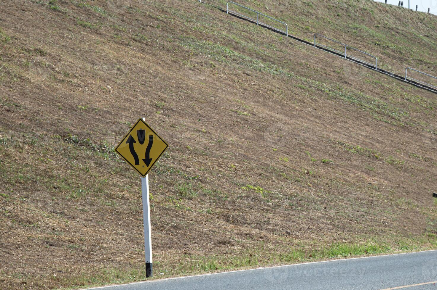 Traffic signs indicate left and right intersections ahead. photo