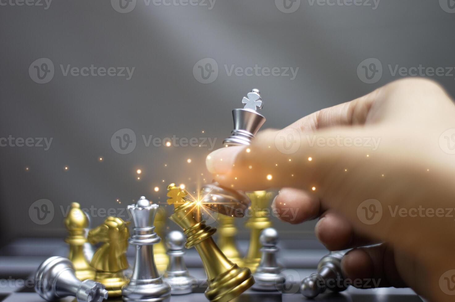 Concept. Businessman moving chess pieces in a successful competition. Management strategy or leadership concept photo