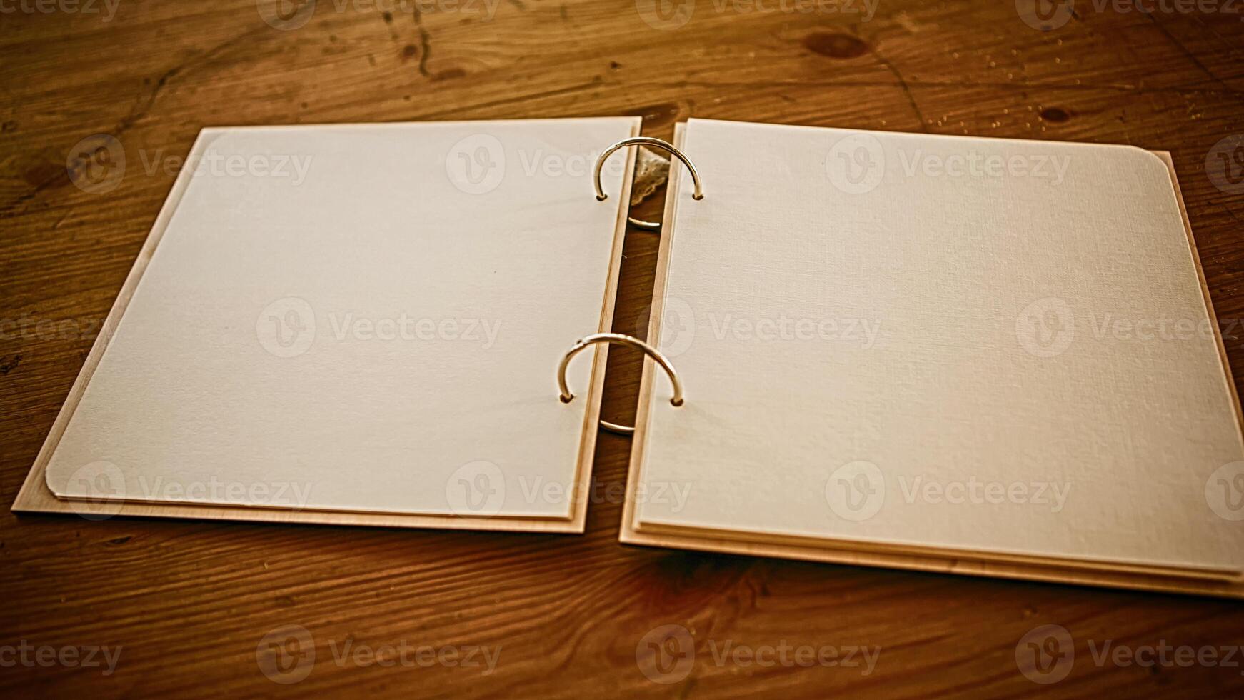 Open notebook with empty craft texture pages. Personal diary with empty pages on a brown or yellow background. A book with empty page photo
