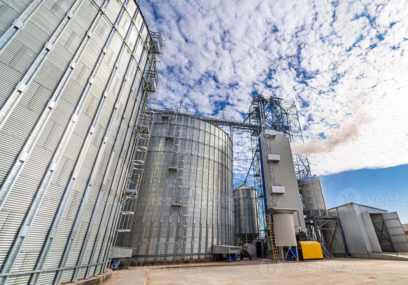 Large warehouse hangar and big construction on blue sky. Great metalic constructions. photo