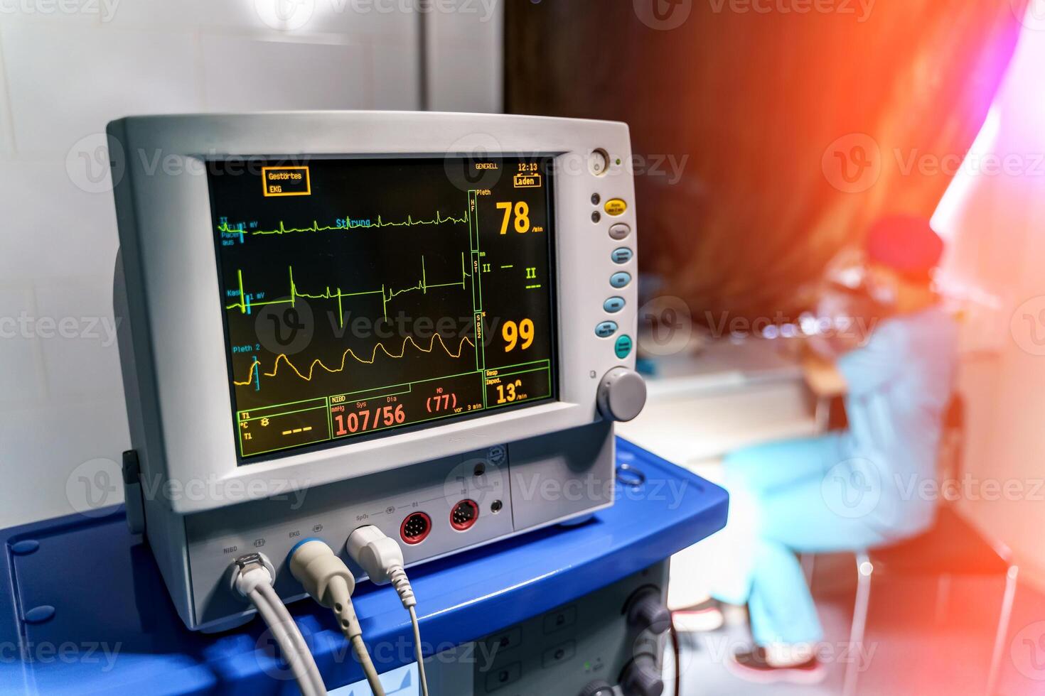 Modern medical monitor displaying statistics of patient. Medical worker working in quarantine. photo