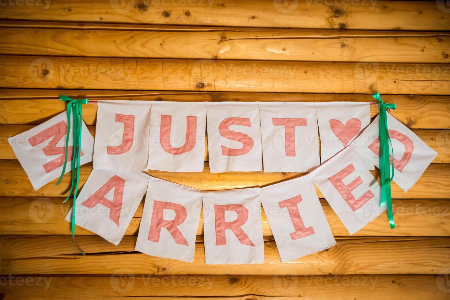 The inscription 'just married' on the wooden background. Wedding details photo