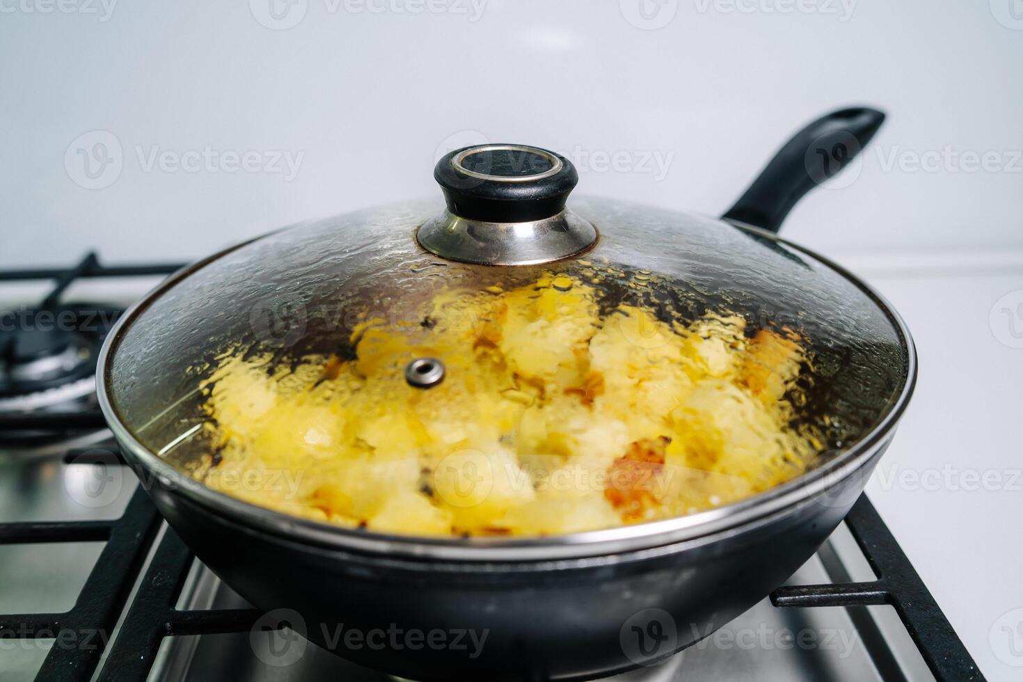 Fried potatoes in a frying pan photo