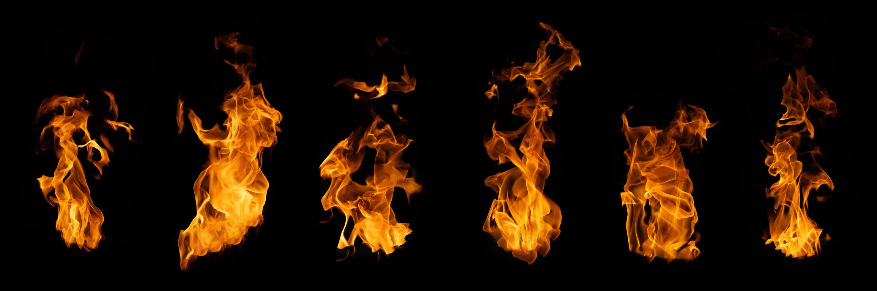 The set of fire and burning flame isolated on dark background for graphic design photo