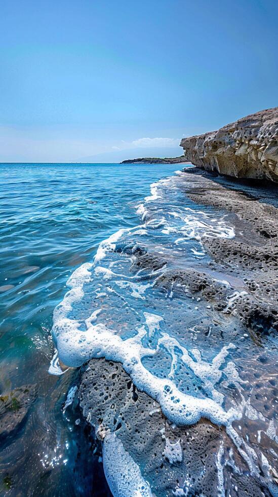 AI generated Blue serenity Tranquil seascape with a textured shoreline in blue Vertical Mobile Wallpaper photo