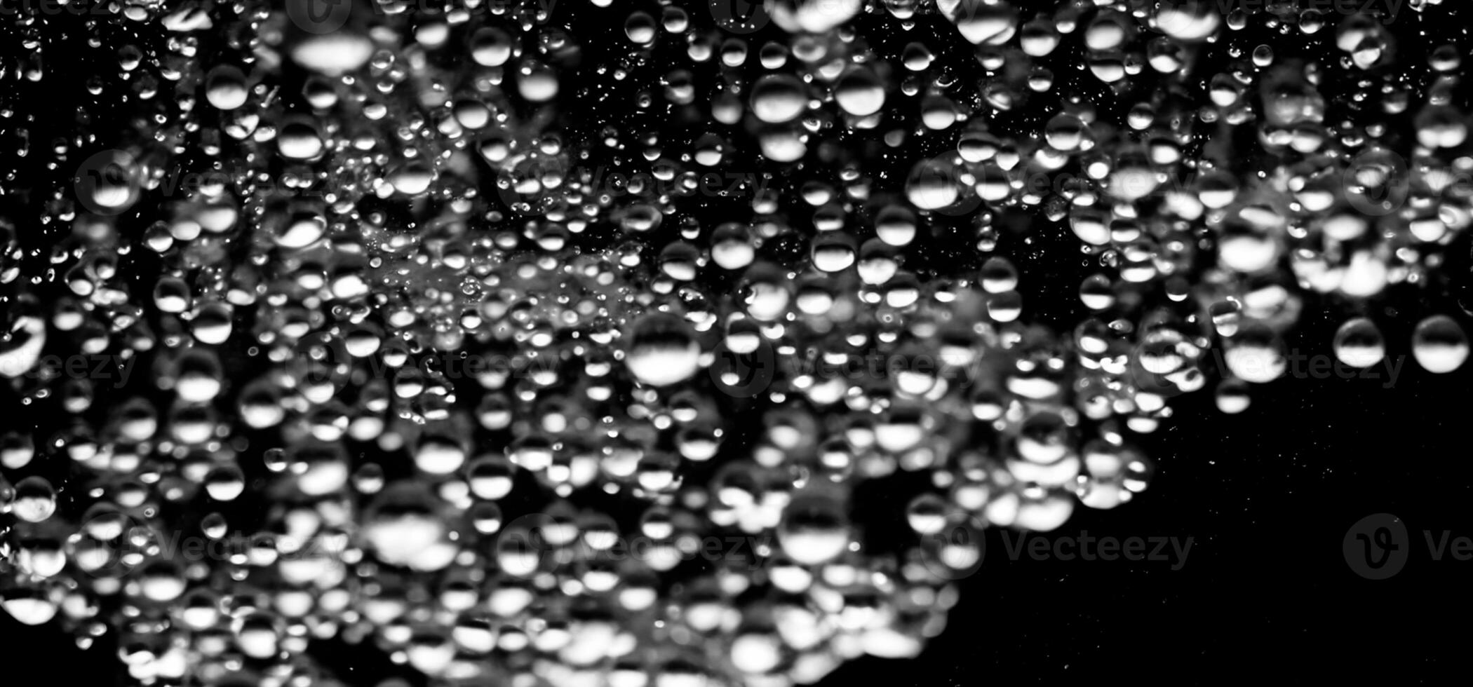 AI generated Soda water bubbles splashing underwater against black background. photo