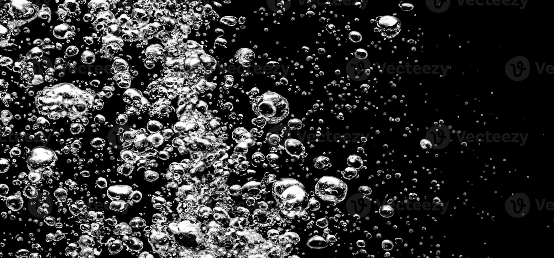 AI generated Soda water bubbles splashing underwater against black background. photo