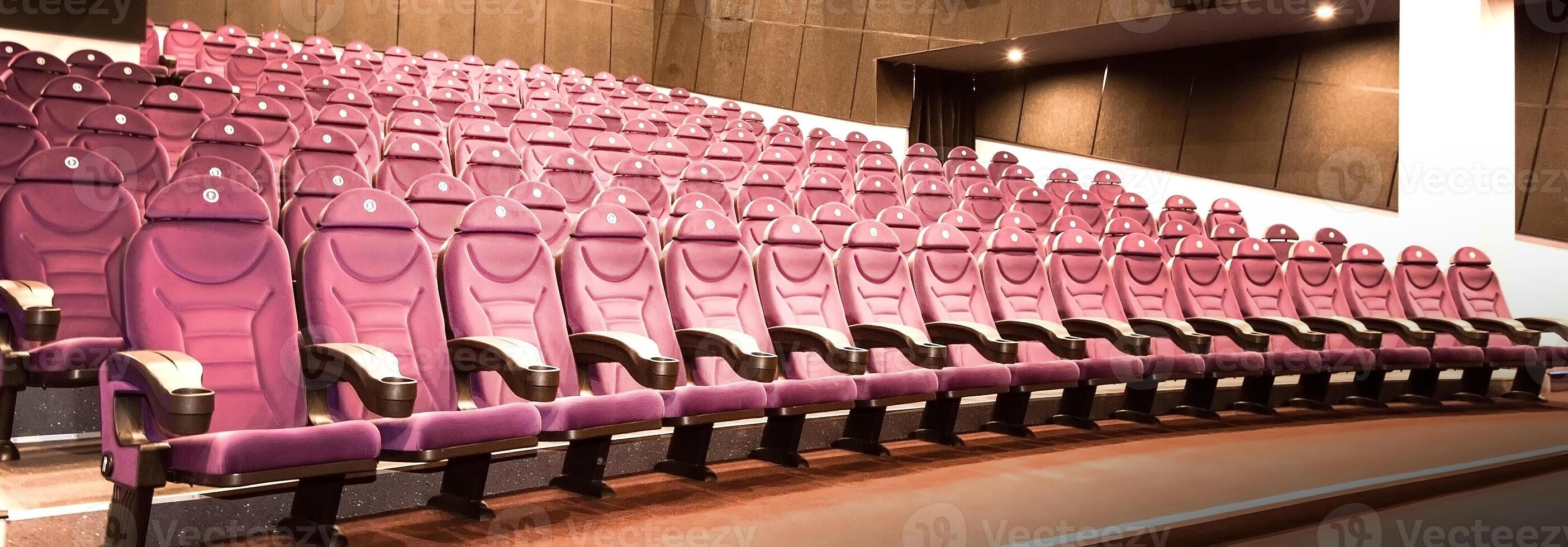 Interior of empty hall with red armchairs photo