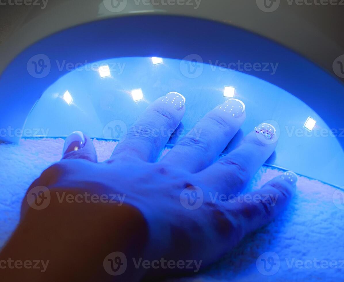 Drying in Nail enamel drying device. Selective focus photo