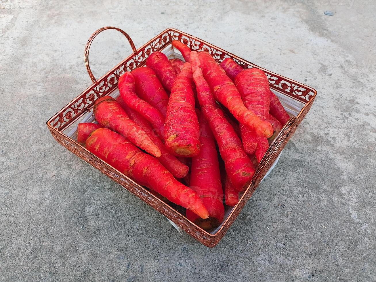 Multiple Carrots in the Backet on the Floor photo