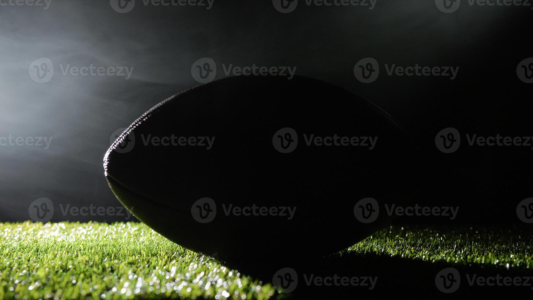 football ball ready to be shot from quarterback photo