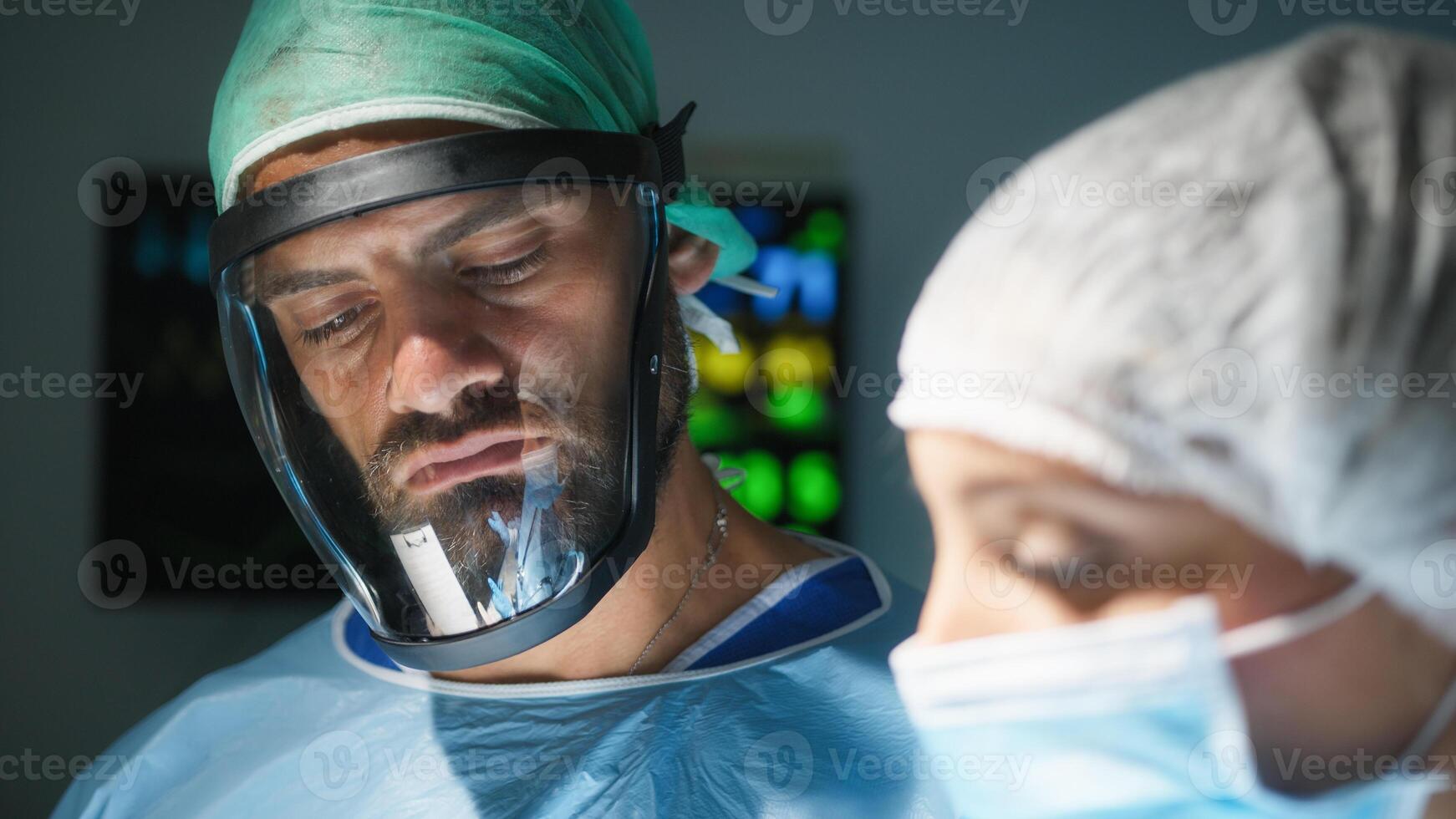 Medical team examine x-ray in surgery room photo