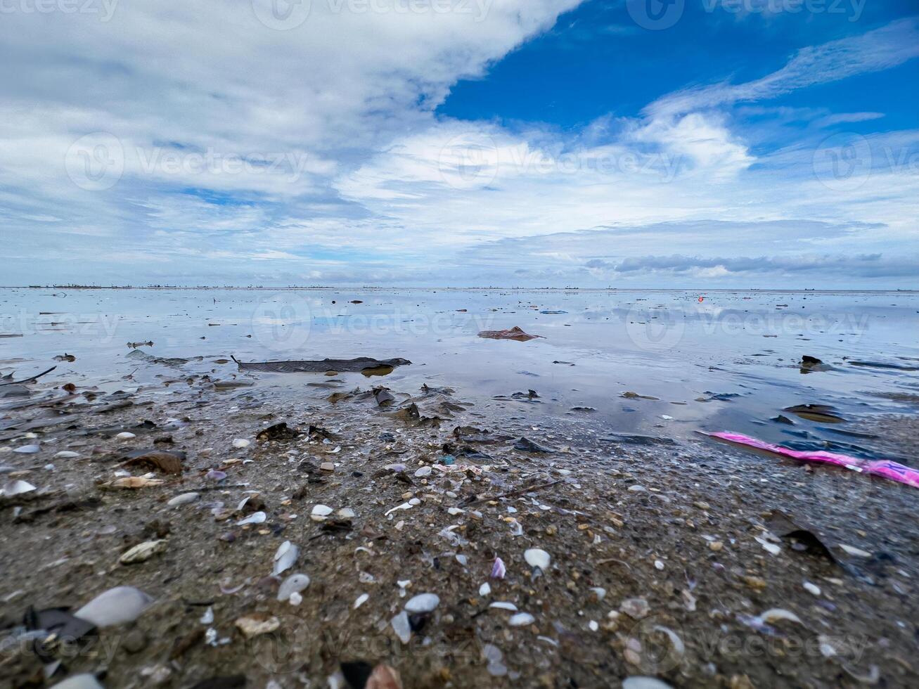 The view of the sea is beautiful, but unfortunately there is a lot of rubbish around the beach photo