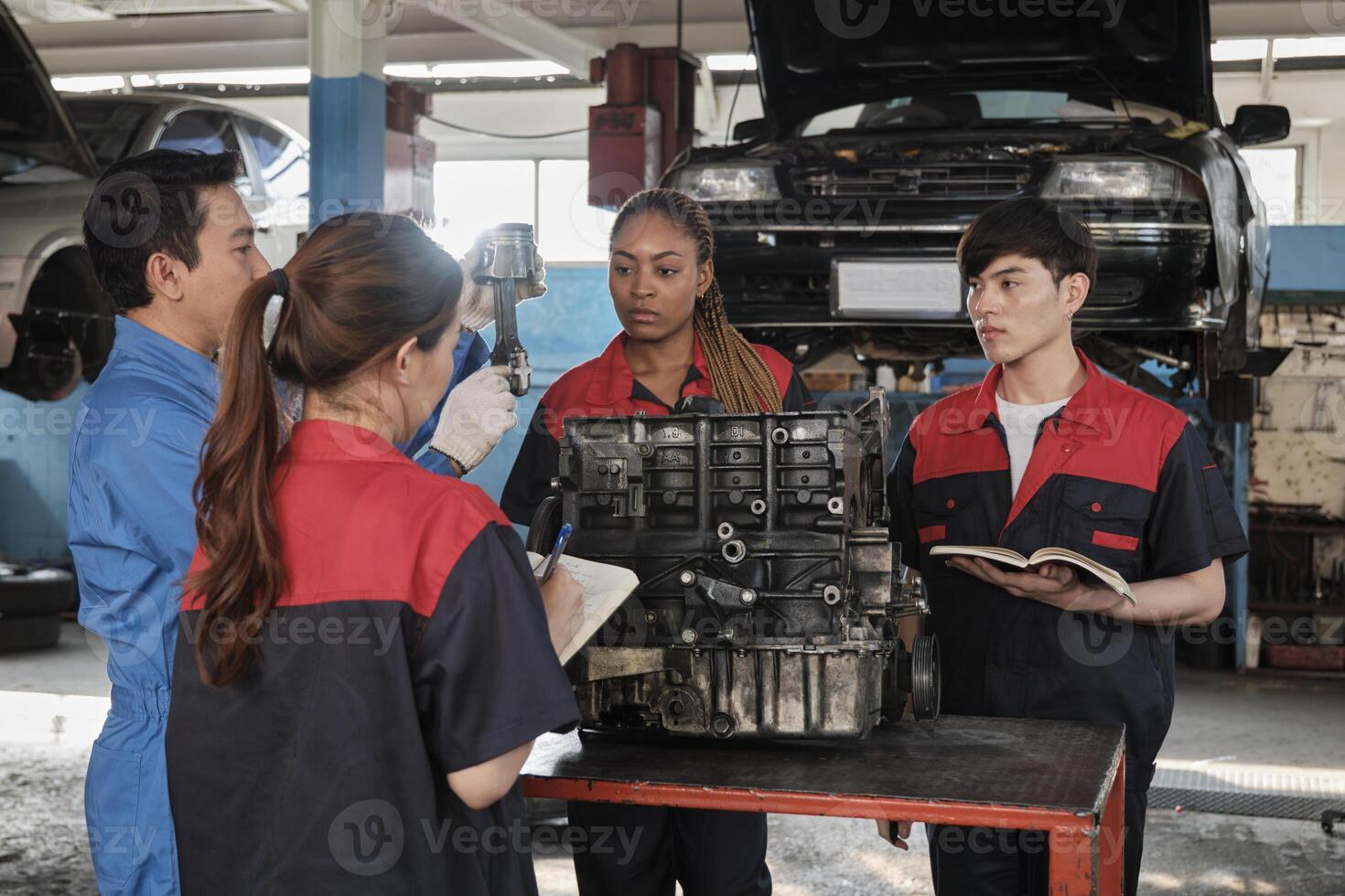 Specialist lecture, a male supervisor engineer train and describe automotive engines with mechanic worker staff teams for repair work at car service garage and maintenance jobs in automobile industry. photo