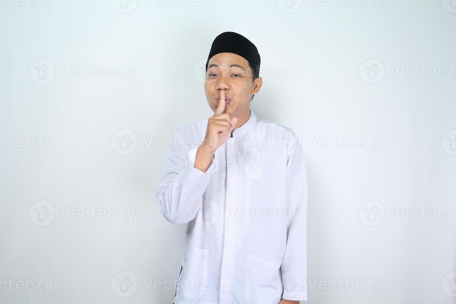 attractive muslim man asian show silent gesture isolated on white background photo