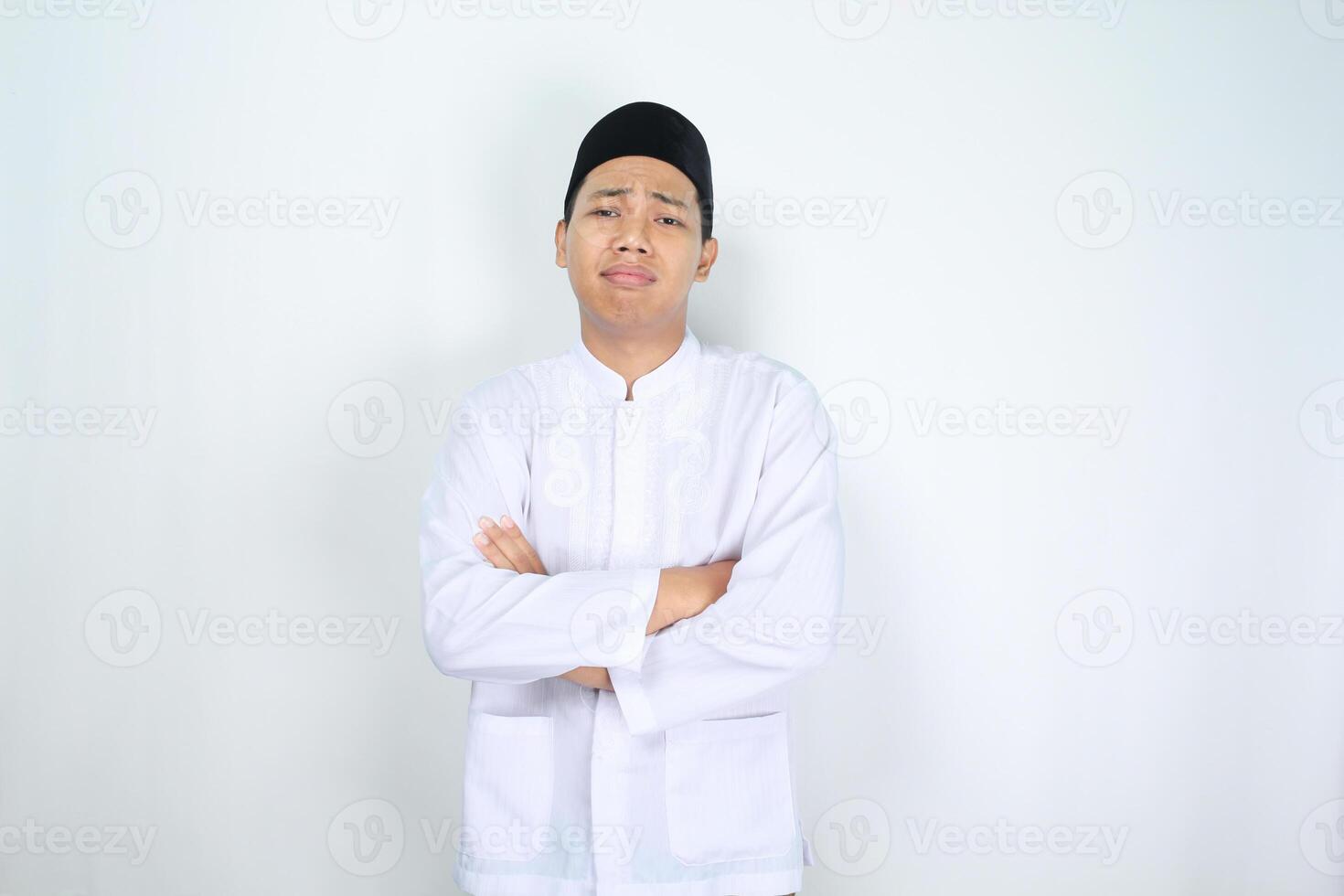 muslim asian man show stressed face expression with crossed hand isolated on white background photo