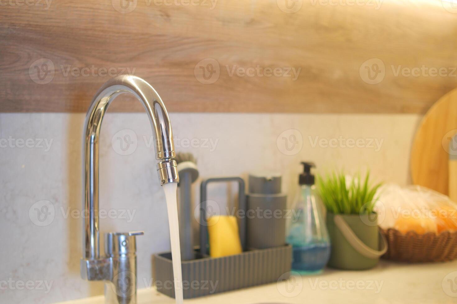 water pouring from a faucet tap slow motion photo