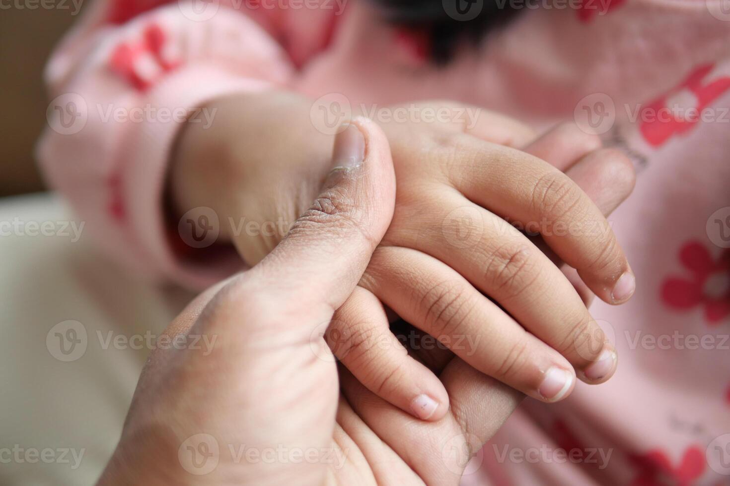 father holding hand of baby child, photo