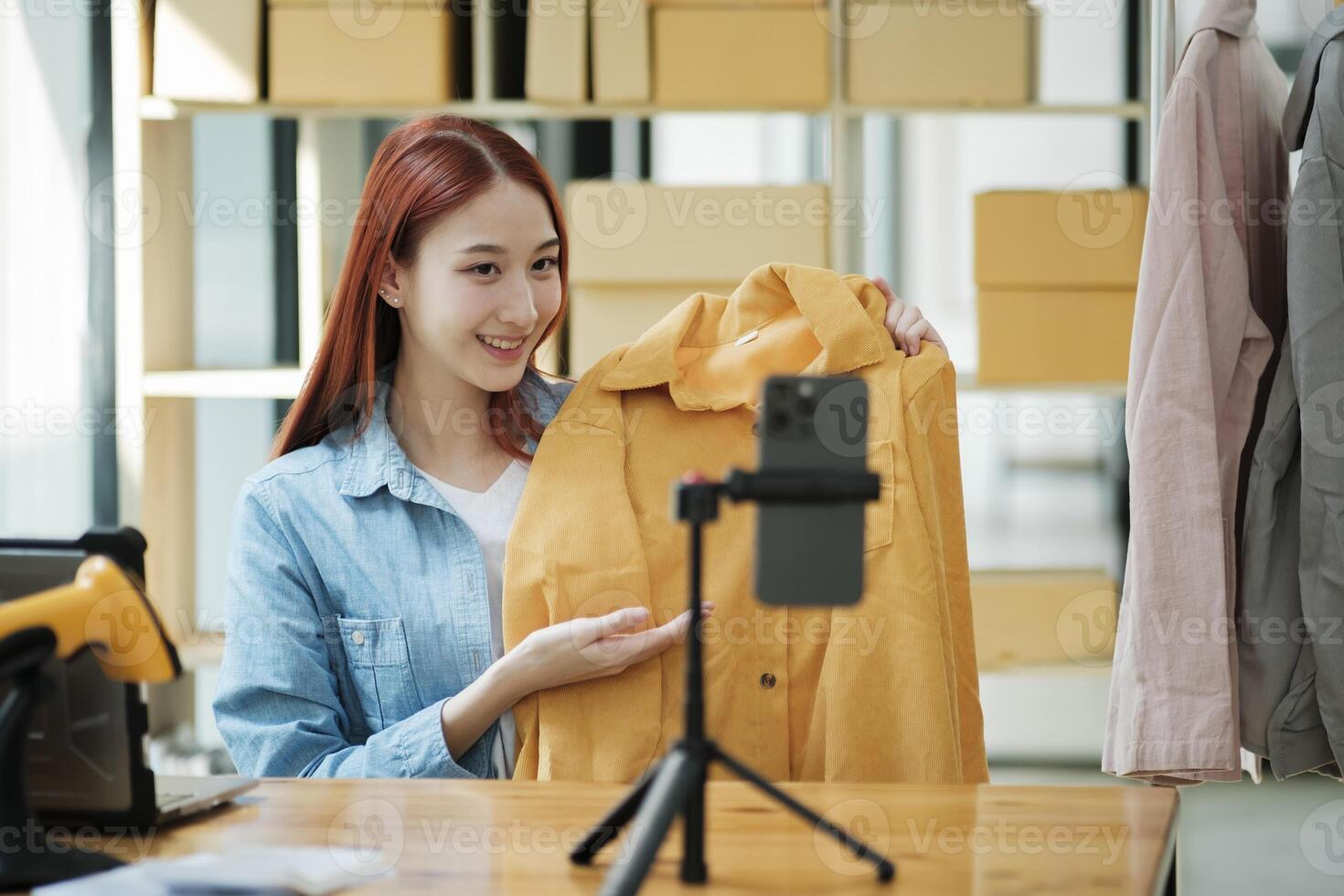 Entrepreneur Showcasing Clothes for Online Store photo