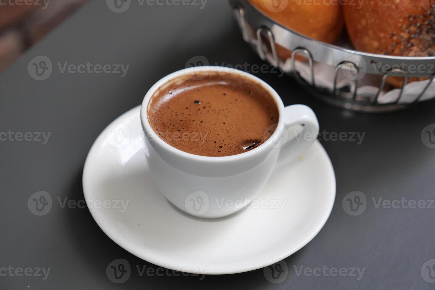 a cup of turkish coffee on table photo