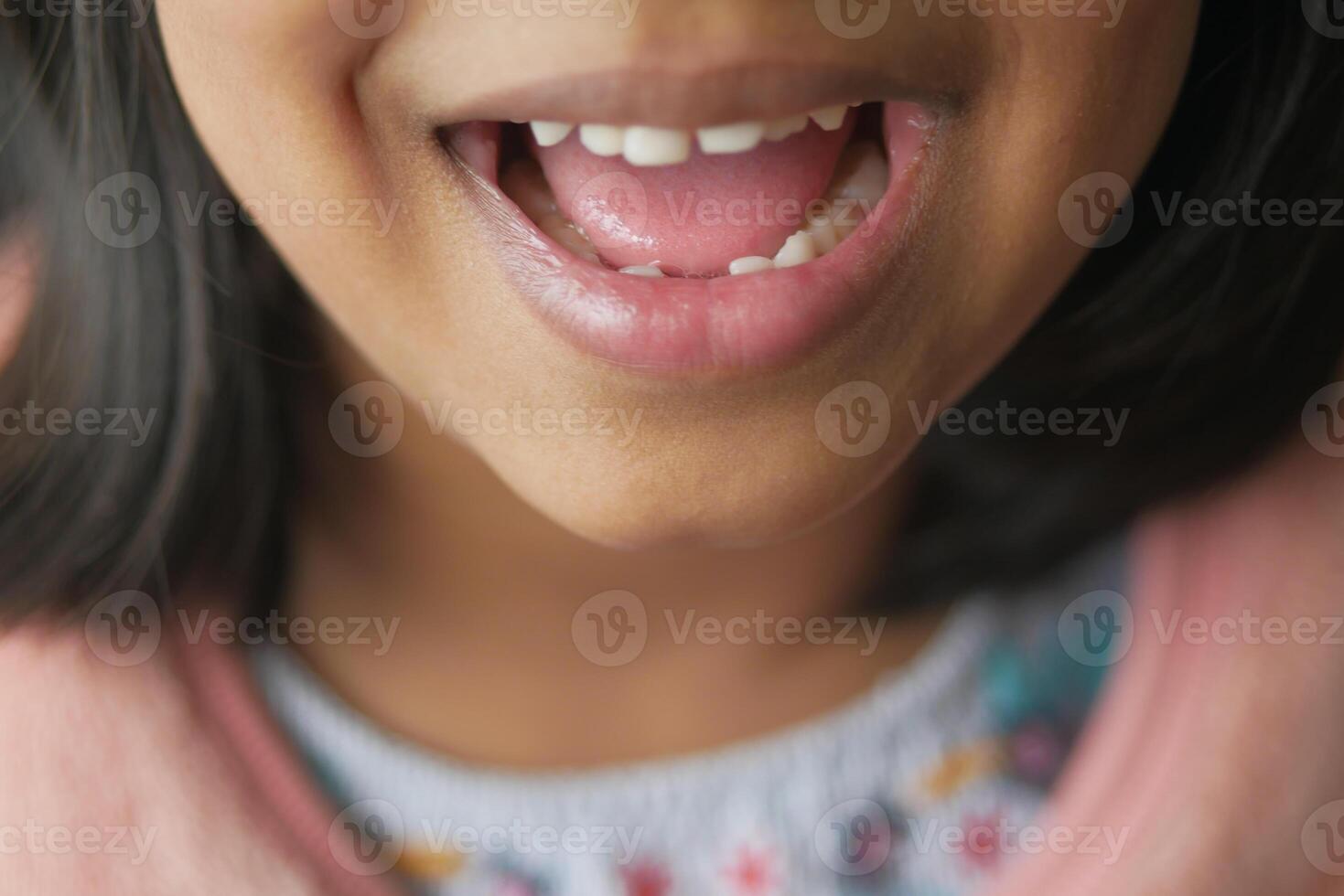 close up of child screaming at home photo