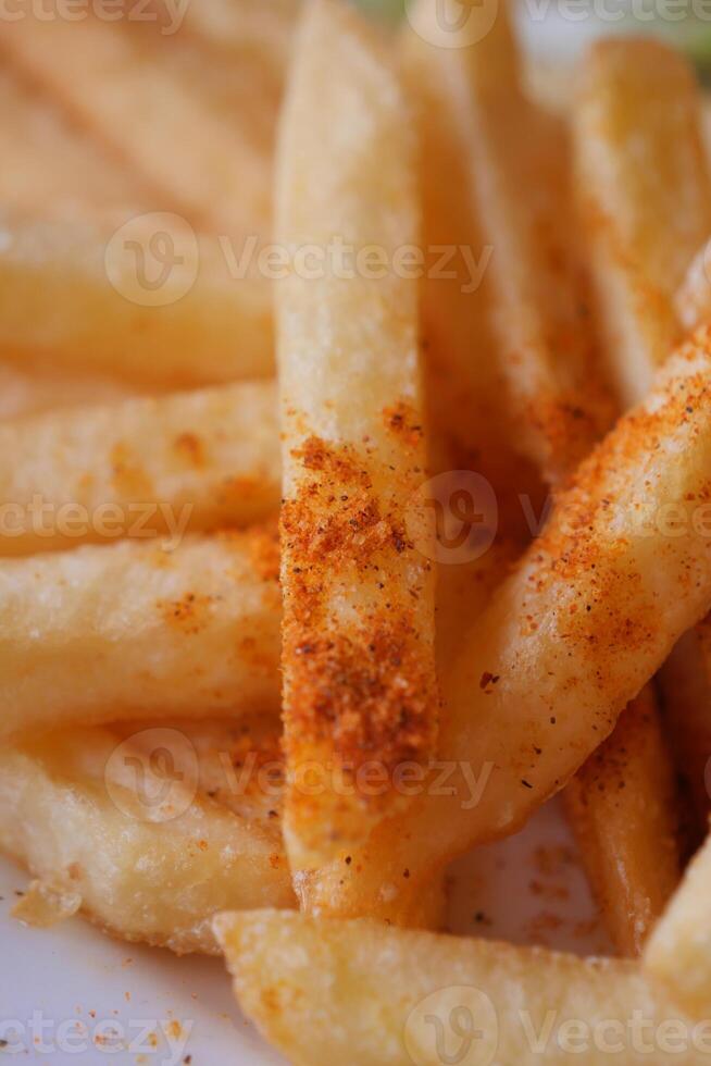 detail shot of French Fries on table photo