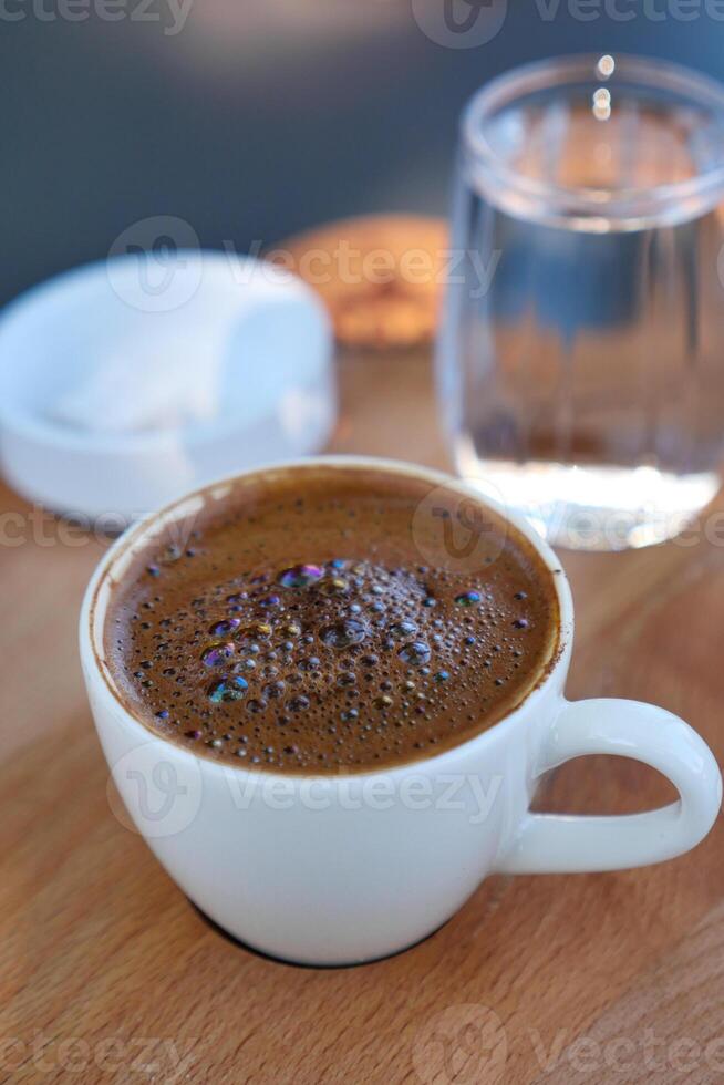 a cup of turkish coffee on table photo