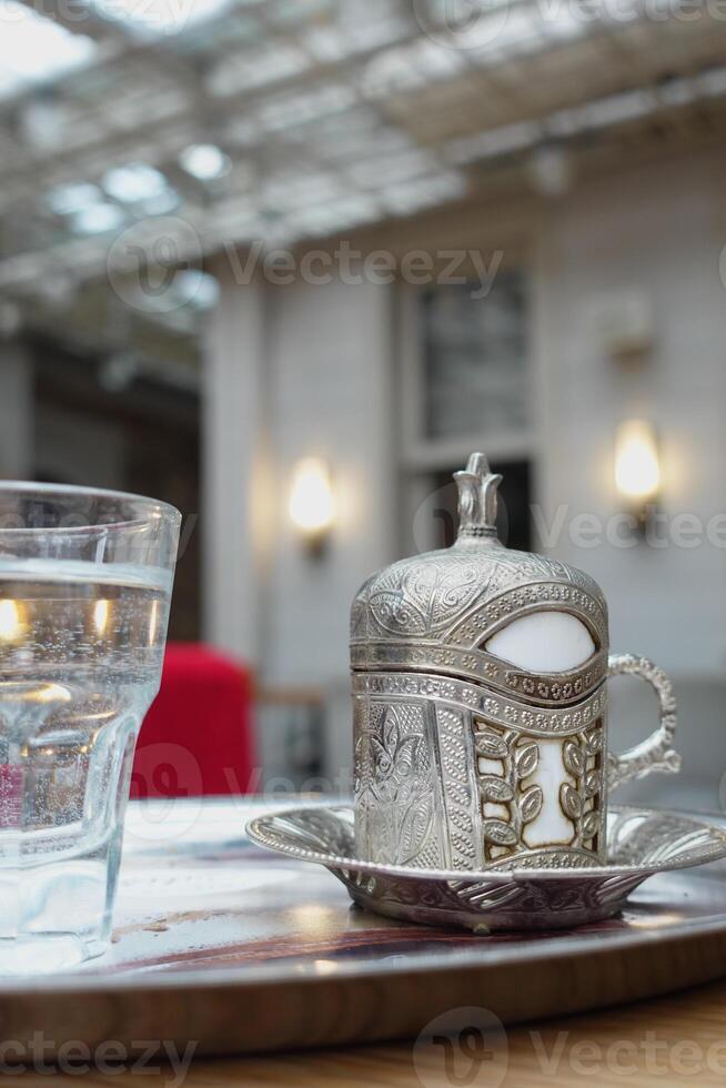 a cup of turkish coffee on table photo