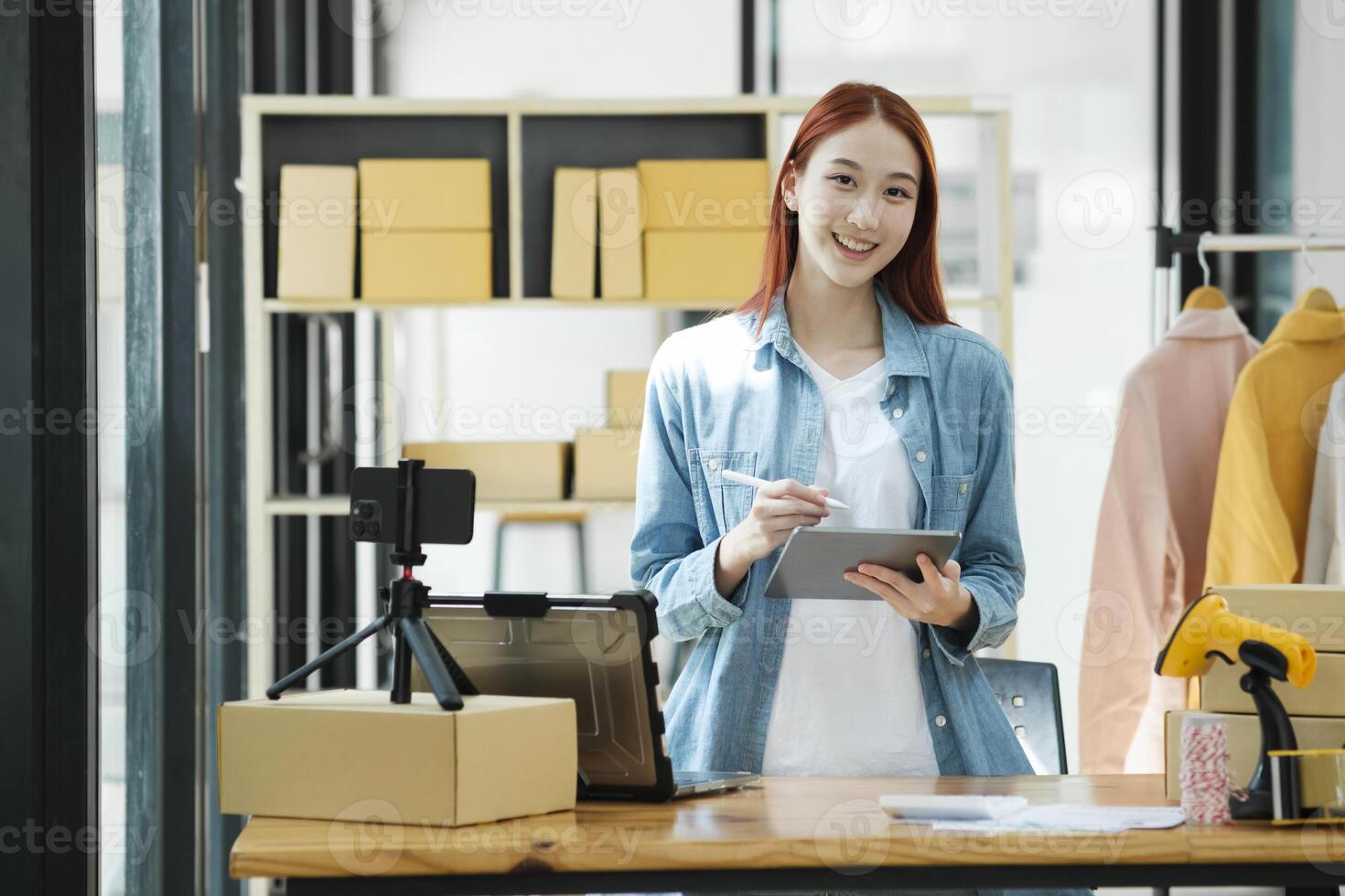 Confident woman portrait entrepreneur at ecommerce fashion or warehouse looking at camera. photo