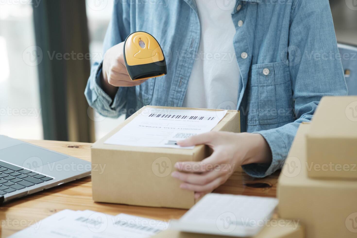 Scanning Barcode on Shipping Box with Scanner photo