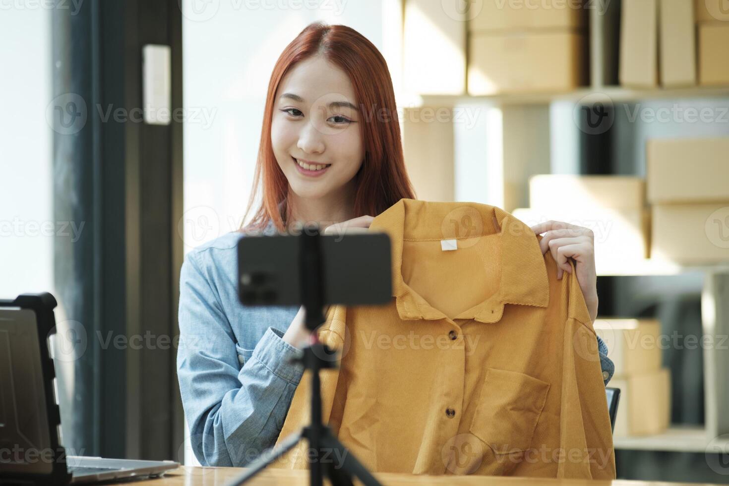 Entrepreneur Showcasing Clothes for Online Store photo