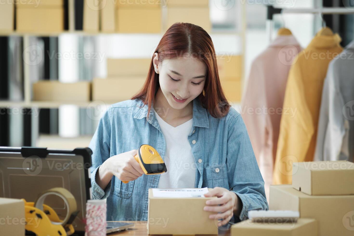 Scanning Barcode on Shipping Box with Scanner photo