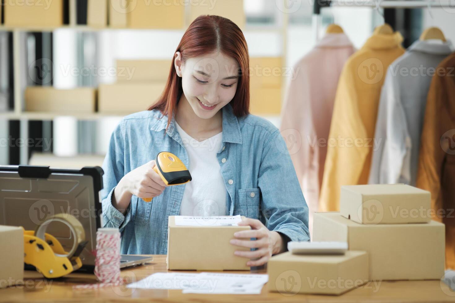 Scanning Barcode on Shipping Box with Scanner photo