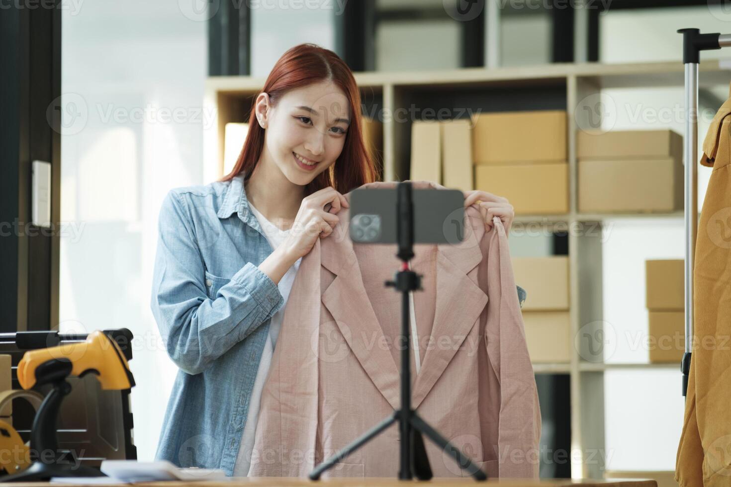 Entrepreneur Showcasing Clothes for Online Store photo