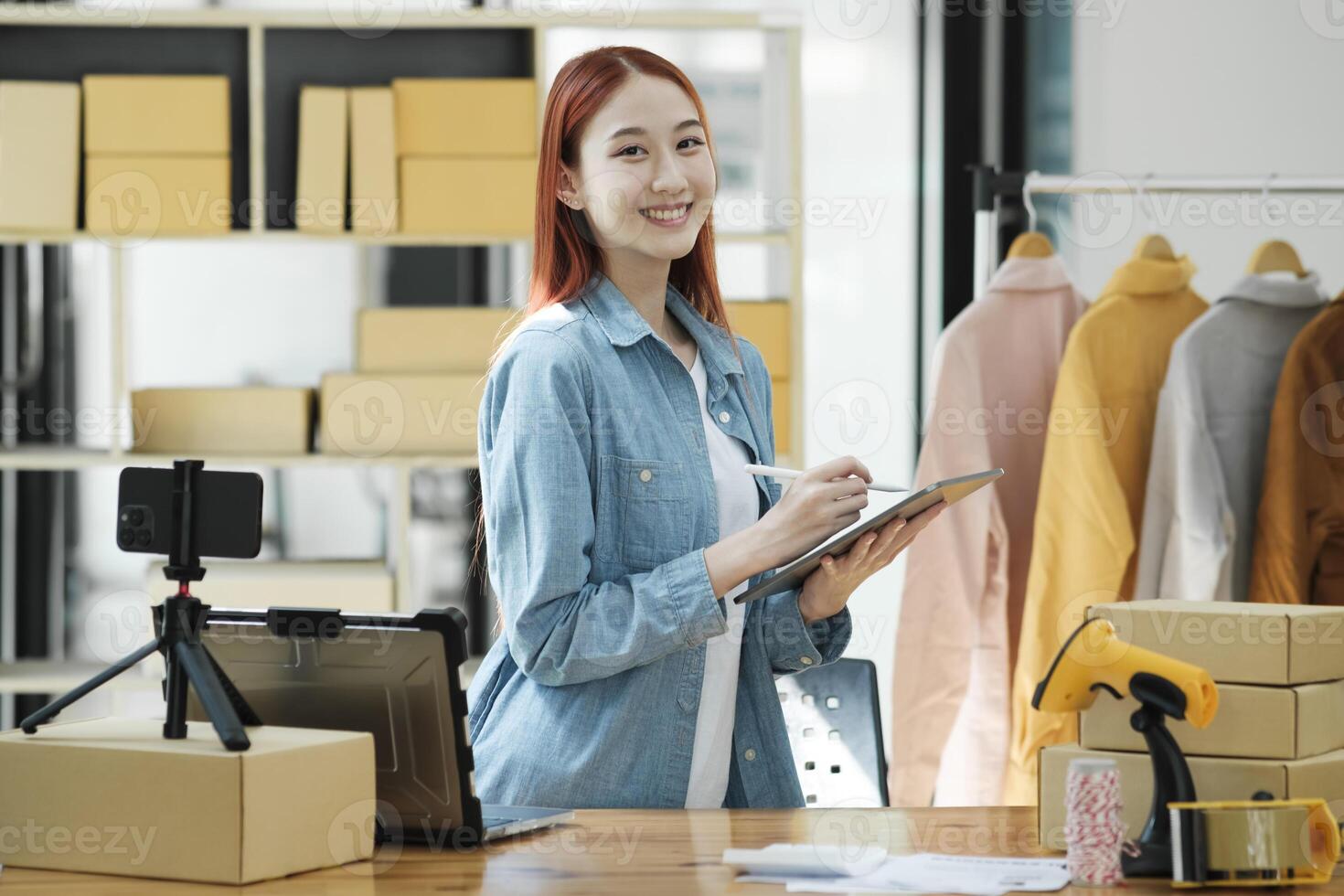 Confident woman portrait entrepreneur at ecommerce fashion or warehouse looking at camera. photo