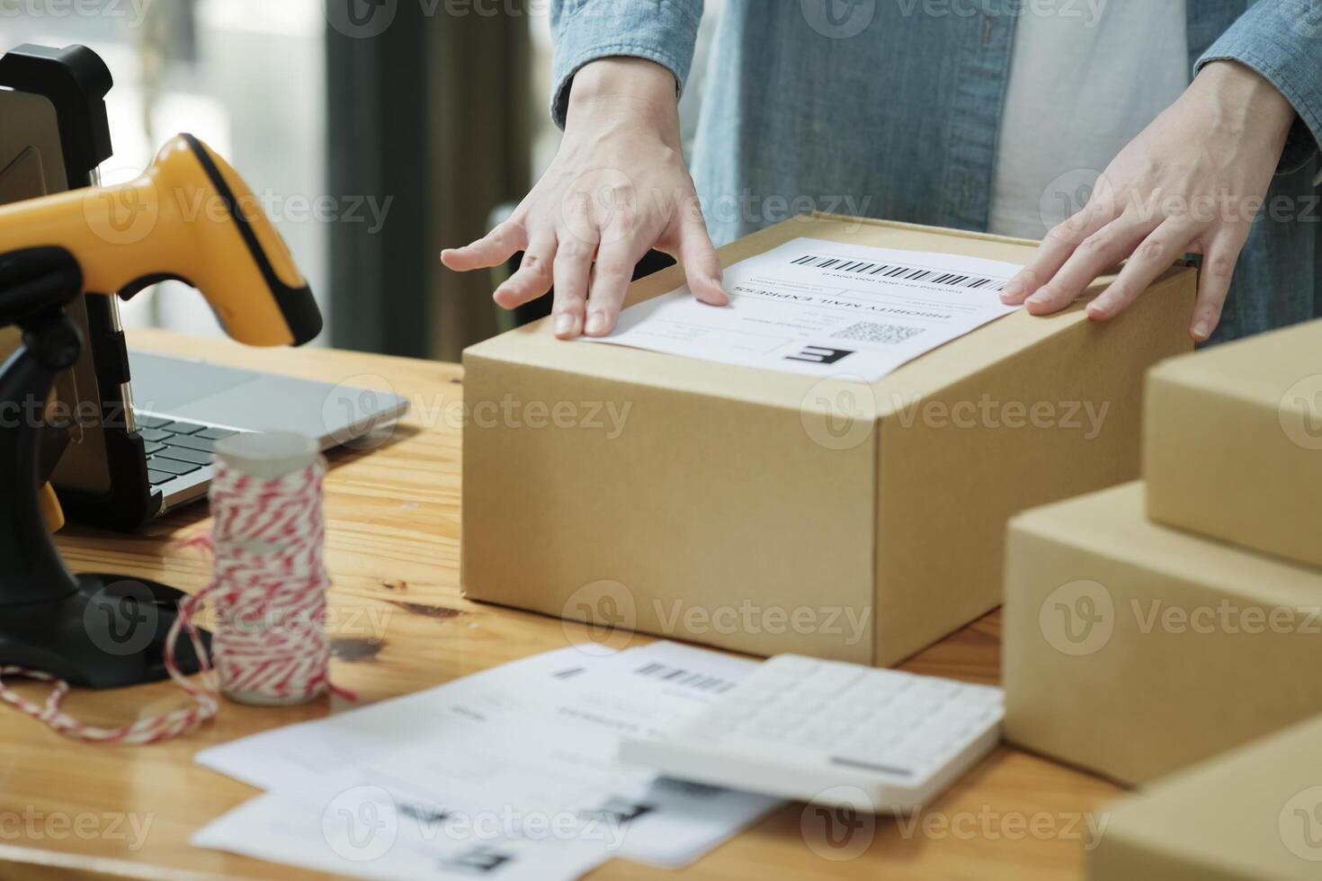 Scanning Barcode on Shipping Box with Scanner photo